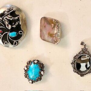 A set of four pins different sizes and designs set in silver, vintage, unbranded